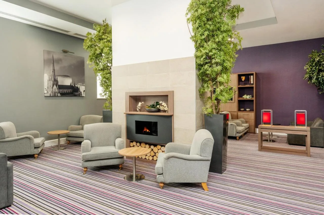 Lounge with fireplace at Staybridge Suites in central Birmingham